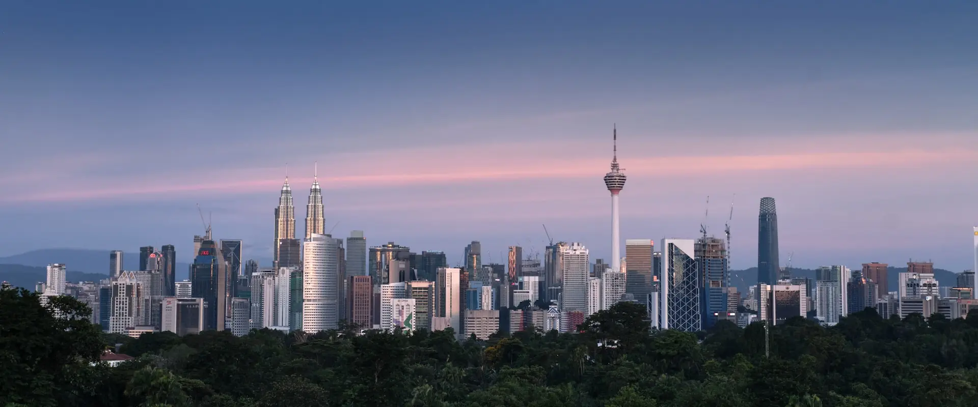 city skyline under blue sky during daytime